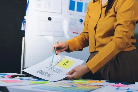 Team of UI UX web designer are working together to develop mobile responsiv.. Stock Photos