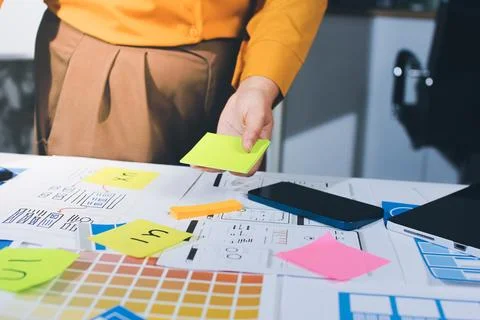 Team of UI UX web designer are working together to develop mobile responsiv.. Stock Photos