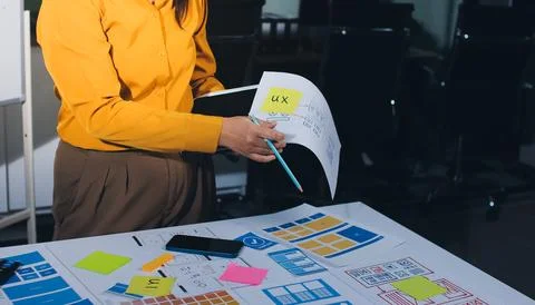 Team of UI UX web designer are working together to develop mobile responsiv.. Stockfoto's
