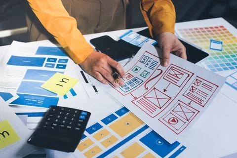 Team of UI UX web designer are working together to develop mobile responsiv.. Stock Photos