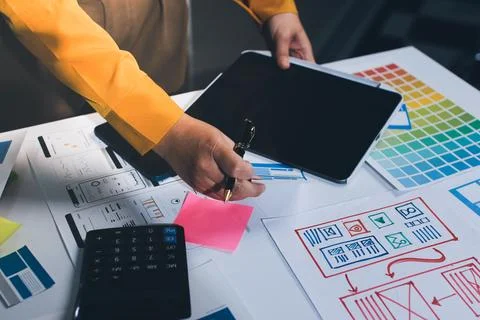 Team of UI UX web designer are working together to develop mobile responsiv.. Stock Photos