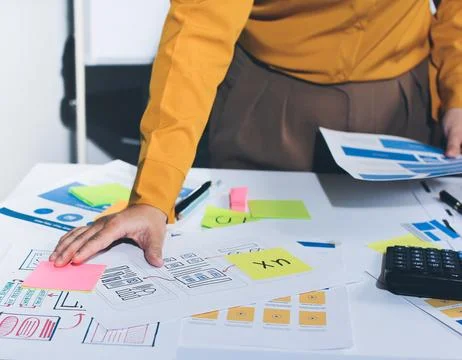 Team of UI UX web designer are working together to develop mobile responsiv.. Stock Photos
