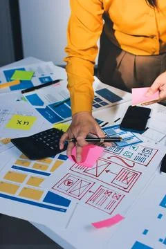 Team of UI UX web designer are working together to develop mobile responsiv.. Stock Photos