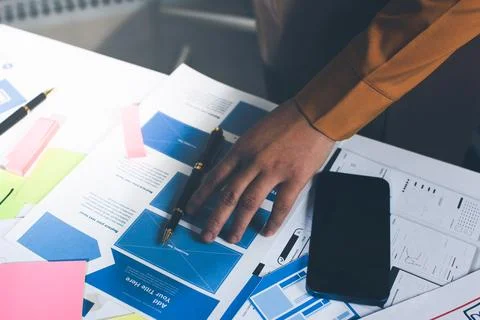 Team of UI UX web designer are working together to develop mobile responsiv.. Stockfoto's