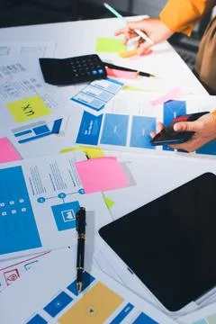 Team of UI UX web designer are working together to develop mobile responsiv.. Stock Photos