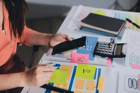 Team of UI UX web designer are working together to develop mobile responsiv.. Stock Photos