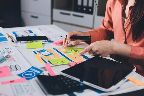Team of UI UX web designer are working together to develop mobile responsiv.. Stock Photos
