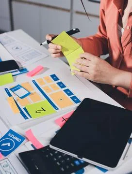 Team of UI UX web designer are working together to develop mobile responsiv.. Stock Photos