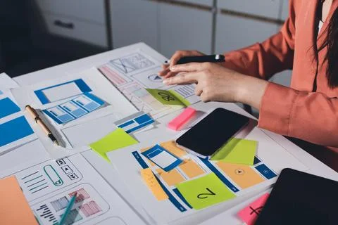 Team of UI UX web designer are working together to develop mobile responsiv.. Stock Photos