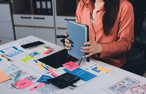 Team of UI UX web designer are working together to develop mobile responsiv.. Stock Photos