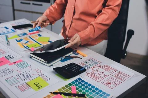 Team of UI UX web designer are working together to develop mobile responsiv.. Stock Photos