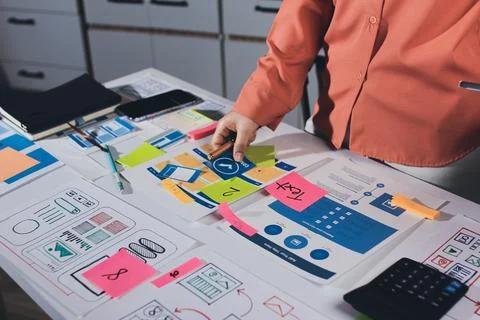 Team of UI UX web designer are working together to develop mobile responsiv.. Stock Photos