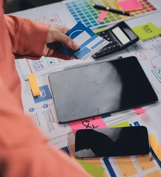 Team of UI UX web designer are working together to develop mobile responsiv.. Stock Photos