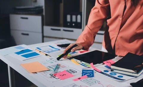 Team of UI UX web designer are working together to develop mobile responsiv.. Stock Photos