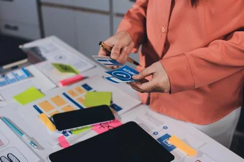 Team of UI UX web designer are working together to develop mobile responsiv.. Stock Photos