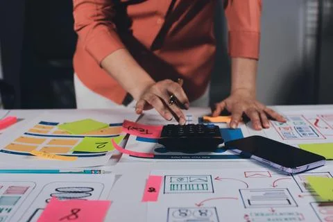 Team of UI UX web designer are working together to develop mobile responsiv.. Stock Photos