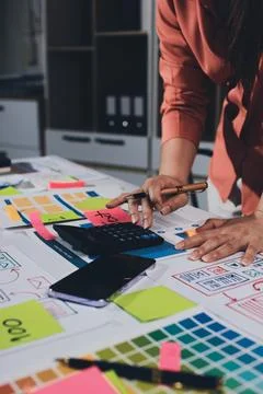 Team of UI UX web designer are working together to develop mobile responsiv.. Stock Photos