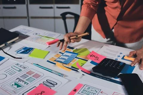 Team of UI UX web designer are working together to develop mobile responsiv.. Stock Photos
