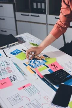 Team of UI UX web designer are working together to develop mobile responsiv.. Stock Photos