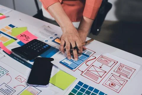 Team of UI UX web designer are working together to develop mobile responsiv.. Stock Photos