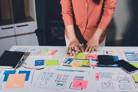 Team of UI UX web designer are working together to develop mobile responsiv.. Stock Photos