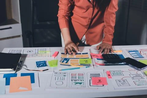 Team of UI UX web designer are working together to develop mobile responsiv.. Stock Photos