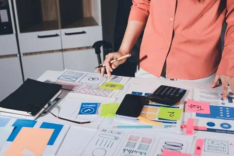 Team of UI UX web designer are working together to develop mobile responsiv.. Stock Photos