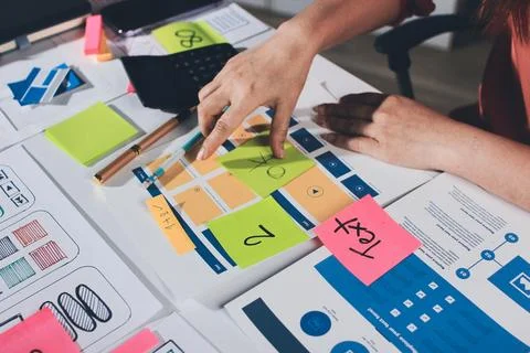 Team of UI UX web designer are working together to develop mobile responsiv.. Stock Photos