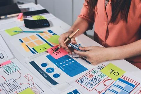 Team of UI UX web designer are working together to develop mobile responsiv.. Stock Photos