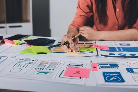 Team of UI UX web designer are working together to develop mobile responsiv.. Stock Photos