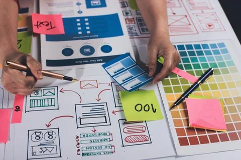 Team of UI UX web designer are working together to develop mobile responsiv.. Stock Photos