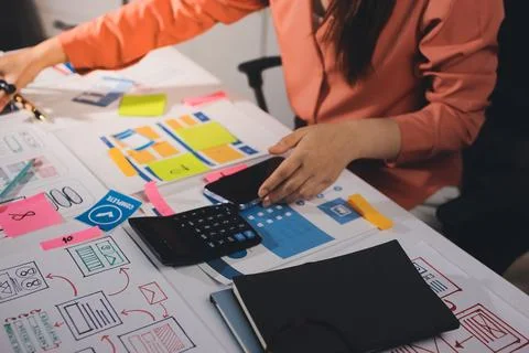 Team of UI UX web designer are working together to develop mobile responsiv.. Stock Photos