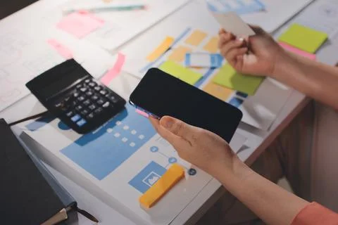 Team of UI UX web designer are working together to develop mobile responsiv.. Stock Photos