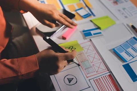 Team of UI UX web designer are working together to develop mobile responsiv.. Stock Photos