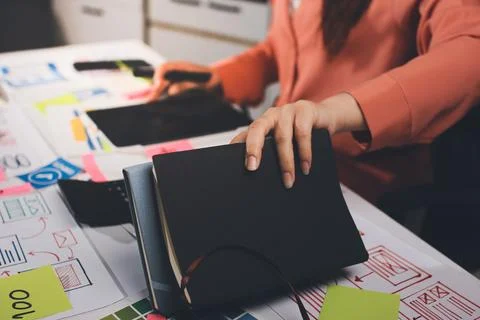Team of UI UX web designer are working together to develop mobile responsiv.. Stock Photos
