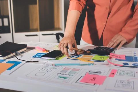 Team of UI UX web designer are working together to develop mobile responsiv.. Stock Photos