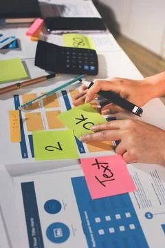 Team of UI UX web designer are working together to develop mobile responsiv.. Stock Photos