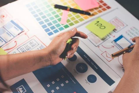 Team of UI UX web designer are working together to develop mobile responsiv.. Stock Photos