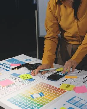 Team of UI UX web designer are working together to develop mobile responsiv.. Stock Photos
