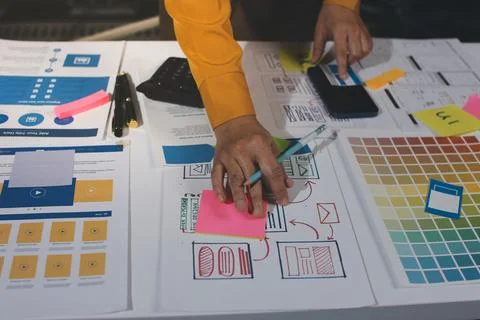 Team of UI UX web designer are working together to develop mobile responsiv.. Stock Photos