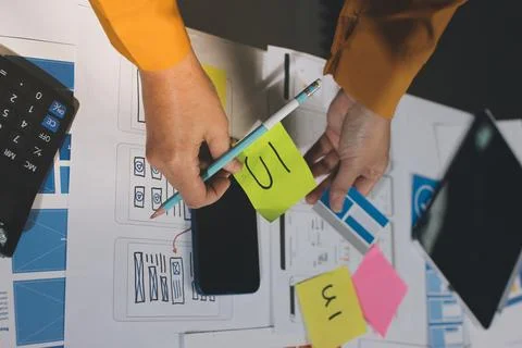 Team of UI UX web designer are working together to develop mobile responsiv.. 库存照片