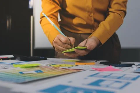 Team of UI UX web designer are working together to develop mobile responsiv.. Stock Photos