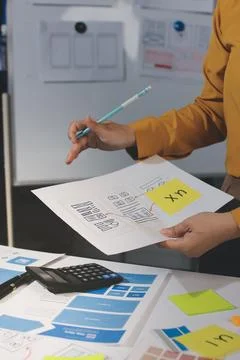 Team of UI UX web designer are working together to develop mobile responsiv.. Stock Photos
