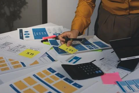 Team of UI UX web designer are working together to develop mobile responsiv.. Stock Photos