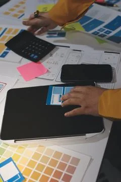 Team of UI UX web designer are working together to develop mobile responsiv.. Stock Photos