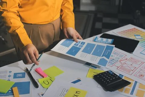Team of UI UX web designer are working together to develop mobile responsiv.. Stock Photos