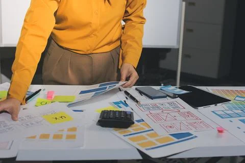 Team of UI UX web designer are working together to develop mobile responsiv.. Stock Photos