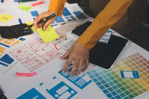 Team of UI UX web designer are working together to develop mobile responsiv.. Stock Photos