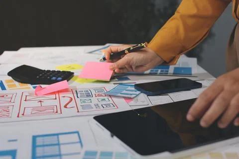 Team of UI UX web designer are working together to develop mobile responsiv.. Stock Photos