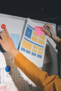 Team of UI UX web designer are working together to develop mobile responsiv.. Stock Photos